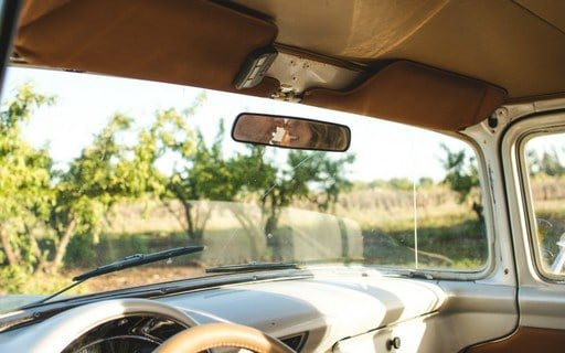 Couple About to kiss in rearview mirror
